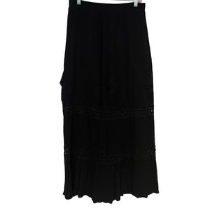 Faded glory peasant skirt. Black in color with elastic waist. Size M (8-10).